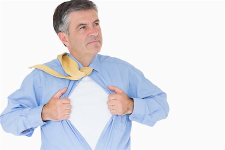 person opening shirt - Serious man pulling his shirt with his hands like a superhero Stock Photo - Budget Royalty-Free & Subscription, Code: 400-06863815