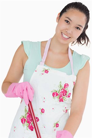 simsearch:400-06863562,k - Smiling woman wearing apron with mop Stockbilder - Microstock & Abonnement, Bildnummer: 400-06863921