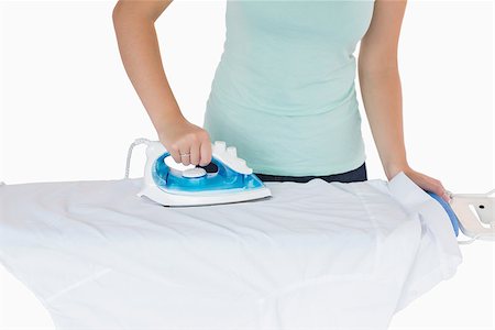 Woman ironing a shirt on a white background Stock Photo - Budget Royalty-Free & Subscription, Code: 400-06863945
