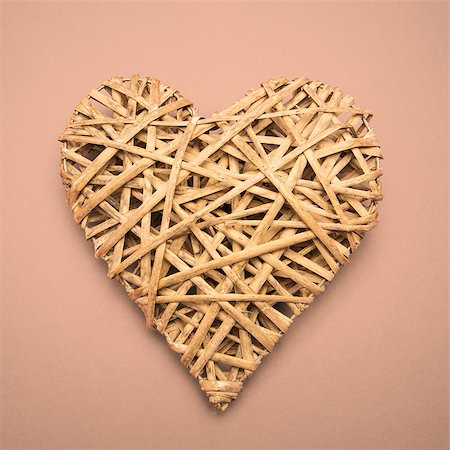 simsearch:400-06873734,k - Wicker heart ornament on pink background Stock Photo - Budget Royalty-Free & Subscription, Code: 400-06874258