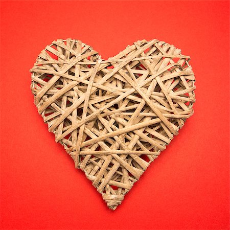 simsearch:400-06873734,k - Wicker heart on red background Stock Photo - Budget Royalty-Free & Subscription, Code: 400-06874260