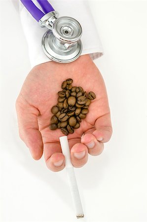 drinking is bad - Top view of stethoscope on smoke and coffee addict hand. Stock Photo - Budget Royalty-Free & Subscription, Code: 400-06875360