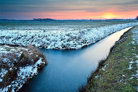 simsearch:400-06875459,k - sunset over winter meadows and frozen canals in Netherlands Stock Photo - Budget Royalty-Free & Subscription, Code: 400-06875455