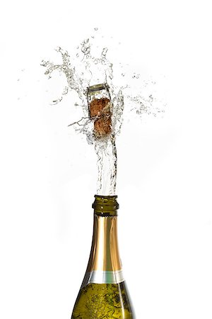 popping champagne cork - Champagne cork popping on white background Stock Photo - Budget Royalty-Free & Subscription, Code: 400-06875481
