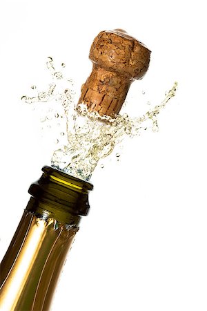 popping champagne cork - Close up of champagne cork popping on white background Stock Photo - Budget Royalty-Free & Subscription, Code: 400-06875482