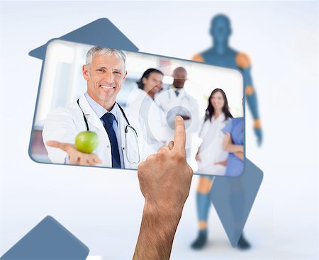 Hand selecting image of doctor holding apple in digital interface witn human figure Stock Photo - Budget Royalty-Free & Subscription, Code: 400-06875563