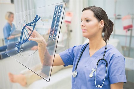 simsearch:400-06875952,k - Nurse touching screen showing blue DNA helix data in hospital ward Stockbilder - Microstock & Abonnement, Bildnummer: 400-06875774