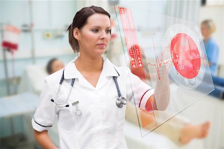 simsearch:400-06875952,k - Nurse pressing screen showing red ECG data in hospital ward Stockbilder - Microstock & Abonnement, Bildnummer: 400-06875776