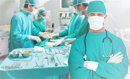 surgery tray - Surgeon standing with his arms crossed during a surgery Stock Photo - Budget Royalty-Free & Subscription, Code: 400-06875886