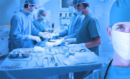 surgery tray - Confident surgeon portrait in front of surgery Stock Photo - Budget Royalty-Free & Subscription, Code: 400-06875887