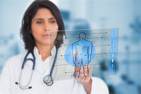 simsearch:400-06875998,k - Serious female doctor touching a touchscreen on hospital Photographie de stock - Aubaine LD & Abonnement, Code: 400-06875958