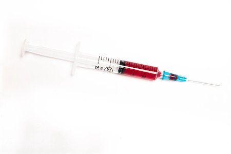 Syringe filled with blood on white background Stock Photo - Budget Royalty-Free & Subscription, Code: 400-06876195