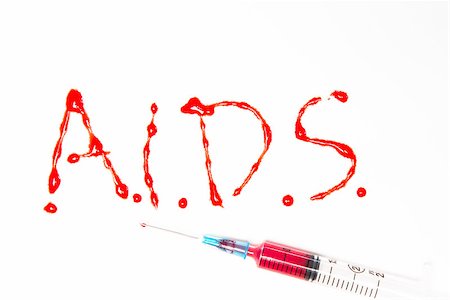simsearch:614-00844433,k - Aids spelled out in blood with syringe on white background Photographie de stock - Aubaine LD & Abonnement, Code: 400-06876196