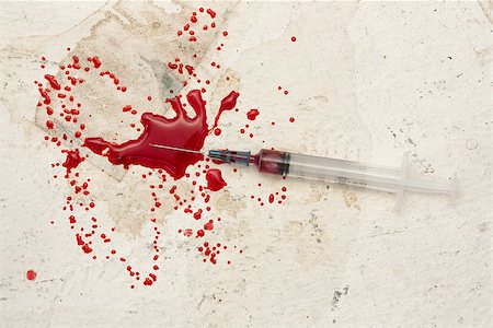 Syringe lying on floor with pool of blood Stock Photo - Budget Royalty-Free & Subscription, Code: 400-06876263