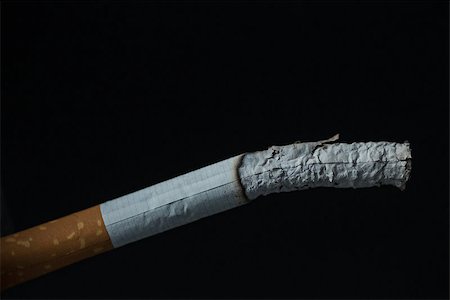 simsearch:400-06876304,k - Burning cigarette close up on black background Stock Photo - Budget Royalty-Free & Subscription, Code: 400-06876295