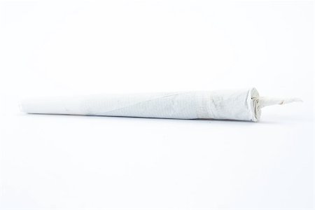 Marijuana cigarette on white background Stock Photo - Budget Royalty-Free & Subscription, Code: 400-06876292