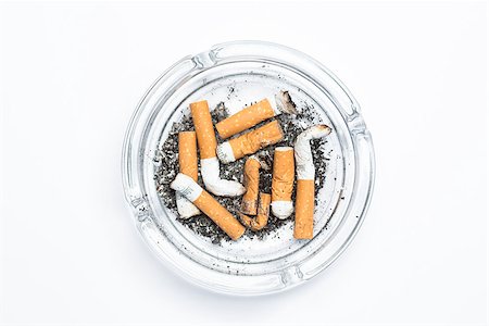 deadly - Overhead of full ashtray on white background Stock Photo - Budget Royalty-Free & Subscription, Code: 400-06876309