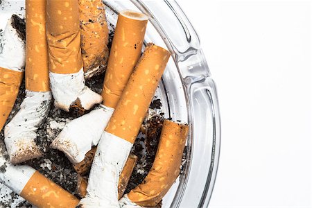 simsearch:400-06876304,k - Close up overhead of ashtray on white background with copy space Stock Photo - Budget Royalty-Free & Subscription, Code: 400-06876313