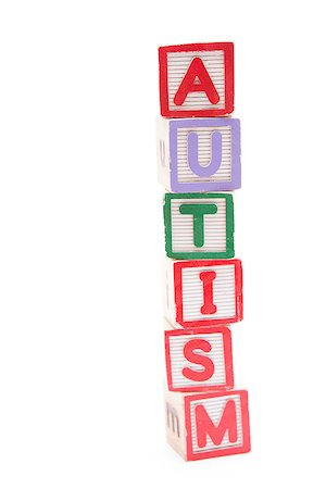 Autism spelled out in stacked letter blocks with copy space on white background Stockbilder - Microstock & Abonnement, Bildnummer: 400-06876344