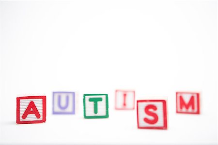 Autism spelled out in letter blocks on white background with copy space Stockbilder - Microstock & Abonnement, Bildnummer: 400-06876343