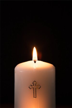 simsearch:400-08017488,k - Catholic candle burning on black background Stock Photo - Budget Royalty-Free & Subscription, Code: 400-06876405