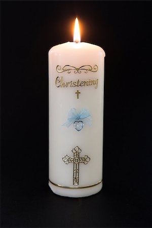 simsearch:400-07090264,k - Lit white christening candle with blue detail on black background Stock Photo - Budget Royalty-Free & Subscription, Code: 400-06876409
