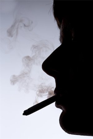 simsearch:400-06876304,k - Close up silhouette of smoking man on white and grey background Foto de stock - Super Valor sin royalties y Suscripción, Código: 400-06876421