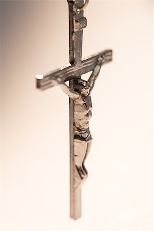 simsearch:400-08017488,k - Close up of silver crucifix hanging from rosary beads Stock Photo - Budget Royalty-Free & Subscription, Code: 400-06876436