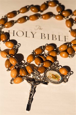 simsearch:400-08017488,k - Silver and wooden rosary beads on first page of bible Stock Photo - Budget Royalty-Free & Subscription, Code: 400-06876432