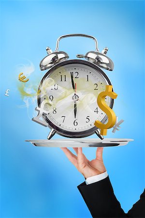 simsearch:400-06876570,k - Waiter holding up time is money concept on blue background Foto de stock - Royalty-Free Super Valor e Assinatura, Número: 400-06876553