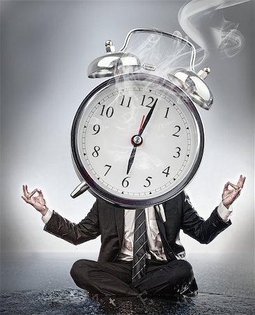 smoke ring - Businessman meditating with face covered by giant smoking alarm clock Stock Photo - Budget Royalty-Free & Subscription, Code: 400-06876628