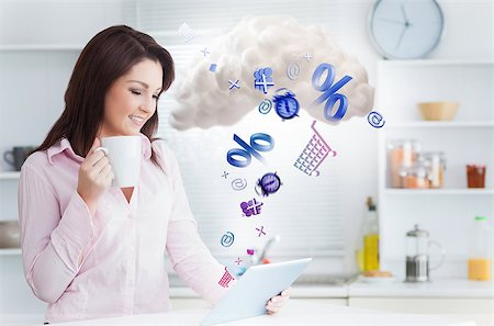 Woman using applications from tablet and connecting to cloud computing in the kitchen at home Stock Photo - Budget Royalty-Free & Subscription, Code: 400-06876728