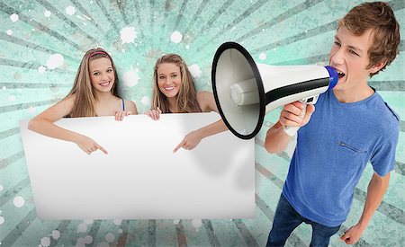 simsearch:400-06876787,k - Pretty girls pointing to copy space with young man shouting through megaphone on blue and grey linear background Foto de stock - Super Valor sin royalties y Suscripción, Código: 400-06876736