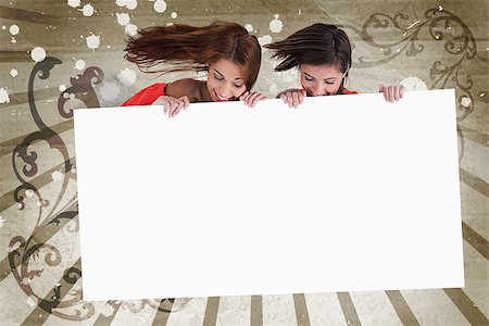 simsearch:400-06876753,k - Young girls looking down at white copy space screen on vintage art deco style background Photographie de stock - Aubaine LD & Abonnement, Code: 400-06876780
