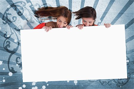 simsearch:400-06876753,k - Smiling girls looking down at white copy space screen on blue art deco style background Photographie de stock - Aubaine LD & Abonnement, Code: 400-06876782