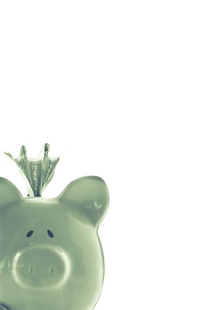 simsearch:400-04881131,k - Dollar sticking out of green piggy bank with copy space on white background Stock Photo - Budget Royalty-Free & Subscription, Code: 400-06877155