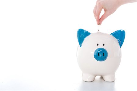 simsearch:400-04881131,k - Hand putting coin into blue and white piggy bank with copy space on white background Stock Photo - Budget Royalty-Free & Subscription, Code: 400-06877186