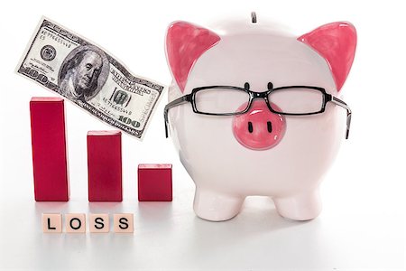 piggy banks losing money - Piggy bank wearing glasses with loss message and pink graph model Stock Photo - Budget Royalty-Free & Subscription, Code: 400-06877201