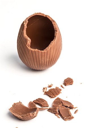 egg cracking - Broken chocolate easter egg on a white background Stock Photo - Budget Royalty-Free & Subscription, Code: 400-06877502