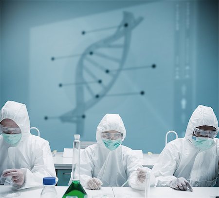 Chemists working in protective suit with futuristic interface showing DNA diagram behind them Stock Photo - Budget Royalty-Free & Subscription, Code: 400-06877701