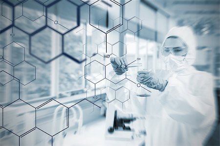 picture for futuristic biotechnology - Chemist working cautiously with liquid helped by futuristic interface in soft focus effect Foto de stock - Super Valor sin royalties y Suscripción, Código: 400-06877719