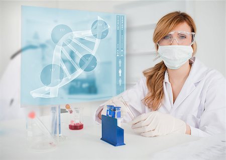 Chemist working in the lab with futuristic interface showing DNA Stock Photo - Budget Royalty-Free & Subscription, Code: 400-06877726