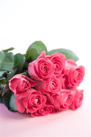 Bouquet of pink roses on a light pink table Stock Photo - Budget Royalty-Free & Subscription, Code: 400-06877836