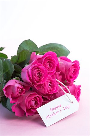 simsearch:400-06877837,k - Bouquet of pink roses with happy mothers day card on a light pink table Stock Photo - Budget Royalty-Free & Subscription, Code: 400-06877837