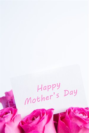 simsearch:400-06877837,k - Bouquet of pink roses with happy mothers day card in pink on white background Stock Photo - Budget Royalty-Free & Subscription, Code: 400-06877830