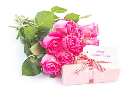 simsearch:400-06877837,k - Bouquet of pink roses next to a gift with a happy birthday card on a white table Stock Photo - Budget Royalty-Free & Subscription, Code: 400-06877848