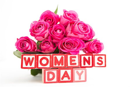 simsearch:400-06877837,k - Bouquet of pink roses next to wooden blocks spelling womens day close up Stock Photo - Budget Royalty-Free & Subscription, Code: 400-06877934