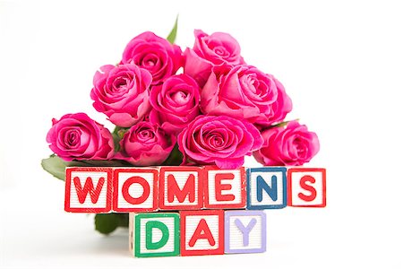simsearch:400-06877945,k - Bunch of pink roses next to wooden blocks spelling womens day on white background Stock Photo - Budget Royalty-Free & Subscription, Code: 400-06877935