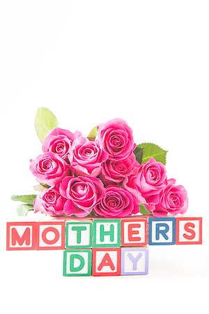 simsearch:400-06877945,k - Bouquet of pink roses next to wooden blocks of different colours spelling mothers day close up Stock Photo - Budget Royalty-Free & Subscription, Code: 400-06877930