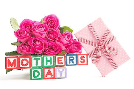 simsearch:400-06877837,k - Bouquet of pink roses and pink gift next to wooden blocks of different colours spelling mothers day close up Stock Photo - Budget Royalty-Free & Subscription, Code: 400-06877932